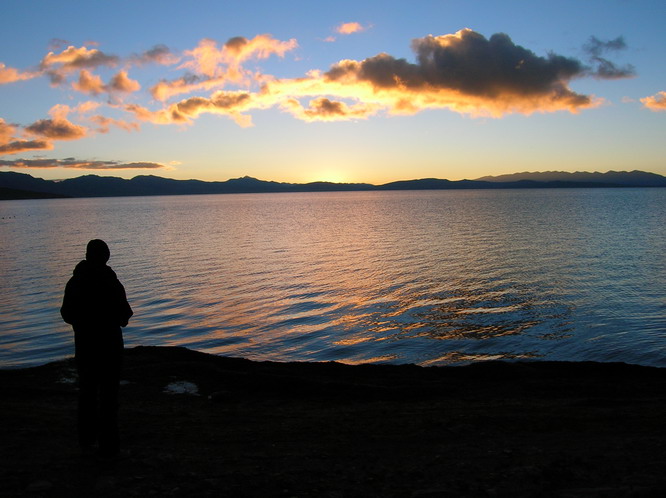 Linda standing at the edge of the lake. Lake Mansarovar, Tibet.